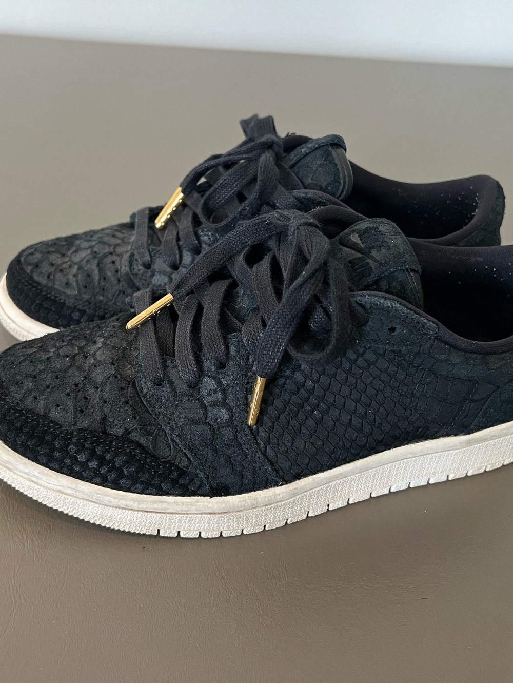 Jordan Women's Black Low-Top Sneakers with Gold Lace Aglets